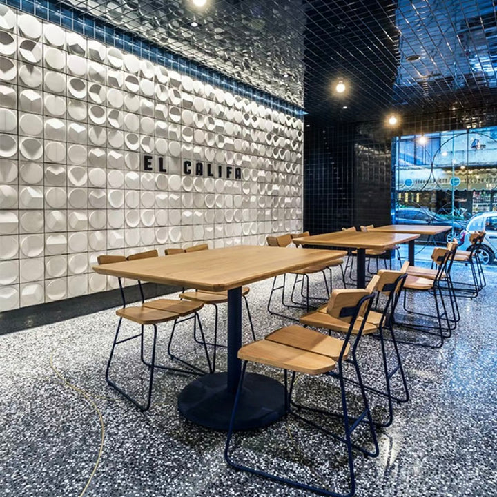 3D cement wall tiles creating a decorative feature wall in a commercial interior space
