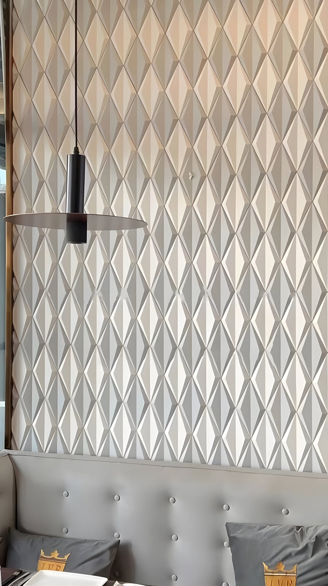 Geometric 3D cement wall tiles used as a decorative interior feature wall