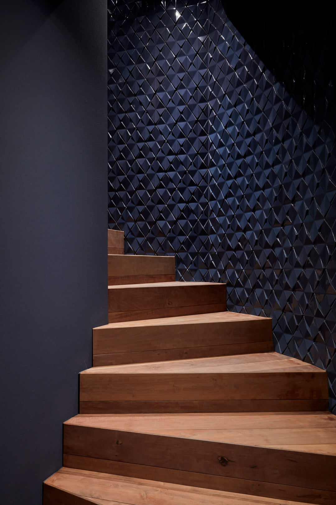 3D cement wall tiles used along a staircase feature wall