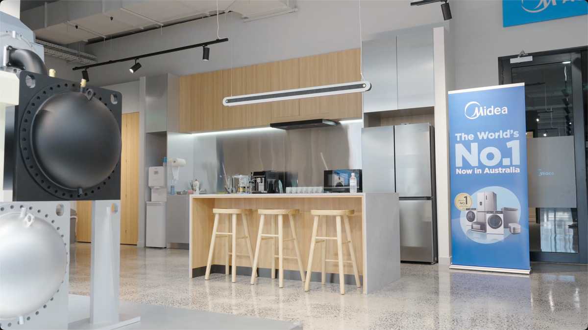 Midea showroom product displays after dark