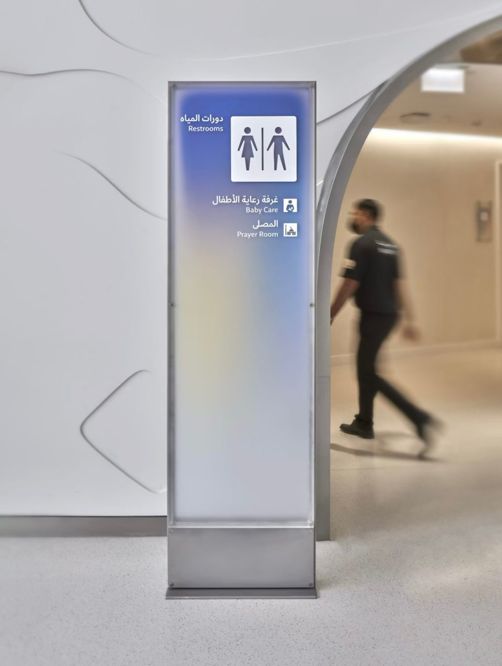 Indoor acrylic gradient wayfinding totem with LED illumination for commercial and public interior spaces