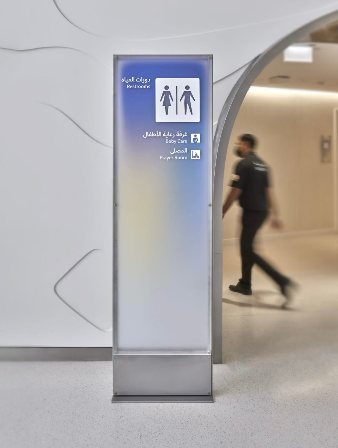 Indoor acrylic gradient wayfinding totem with LED illumination for commercial and public interior spaces