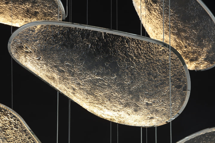 Detail of stainless steel and acrylic modern chandelier panels