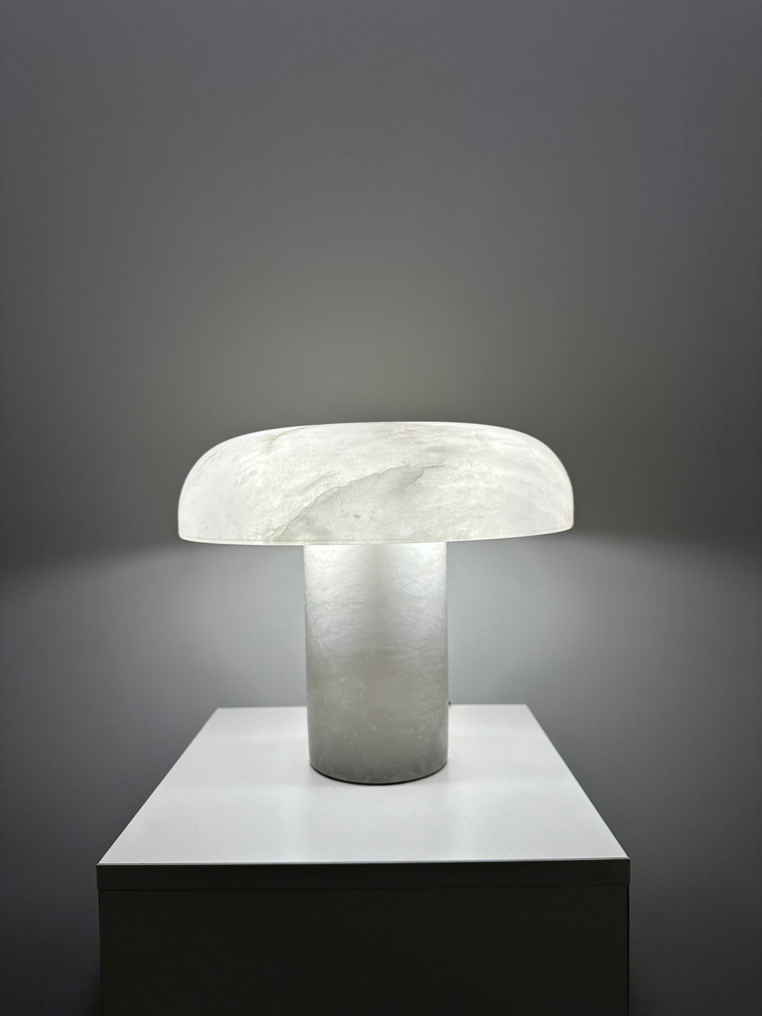 Sculptural alabaster stone table lamp with minimalist modern form, ideal for living rooms, consoles and bedside lighting.
