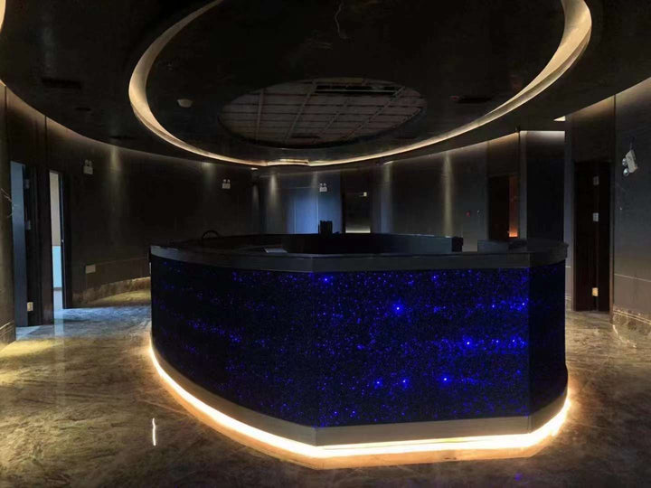 Aluminium foam panels integrated with lighting for a backlit reception and feature counter
