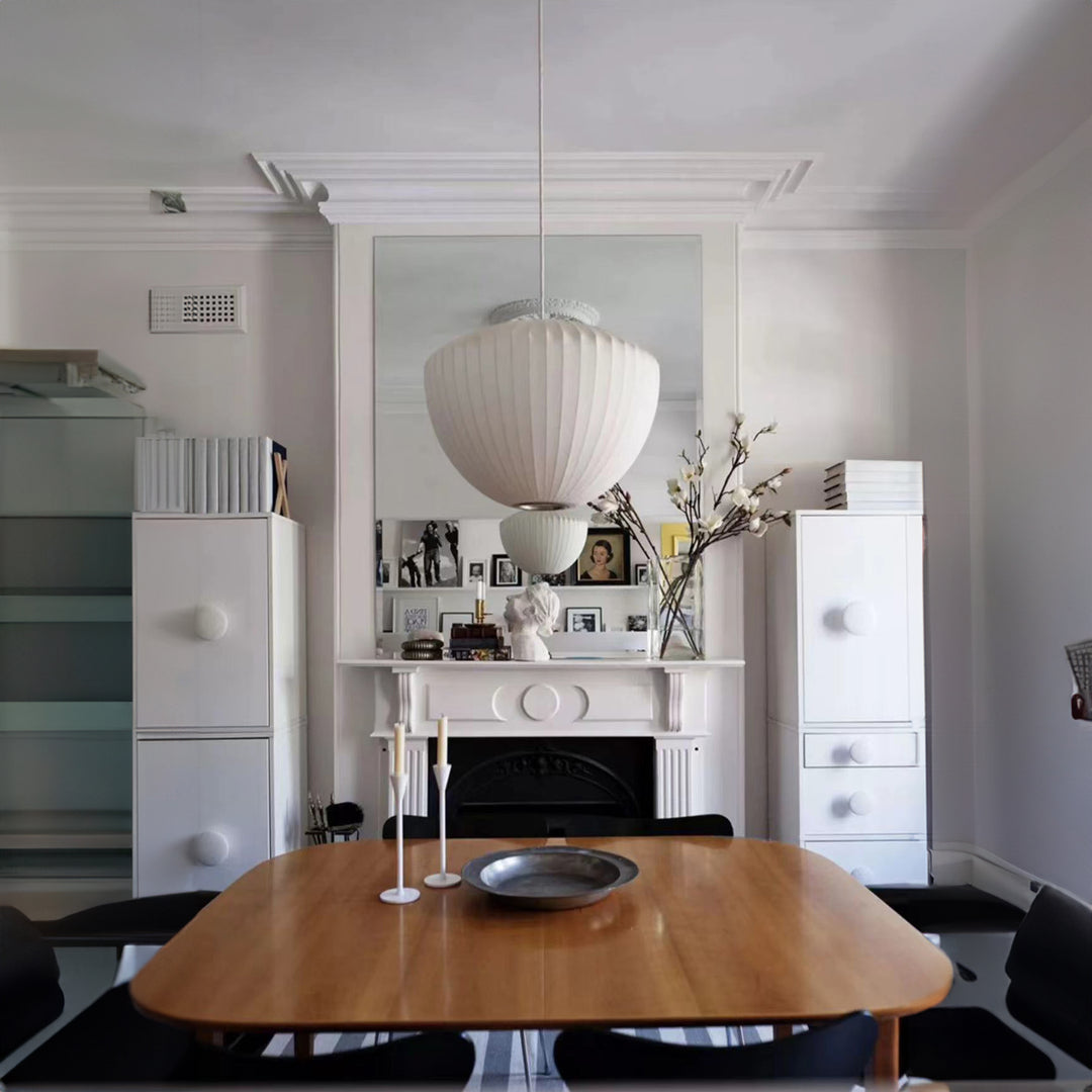 an ambient pendant light used in a kitchen dining space to provide relaxed and comfortable illumination