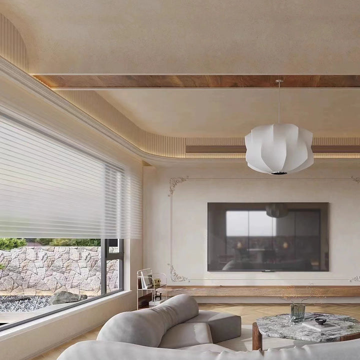 a pendant light hanging within a relaxed interior space, providing warm ambient illumination and a subtle visual focal point