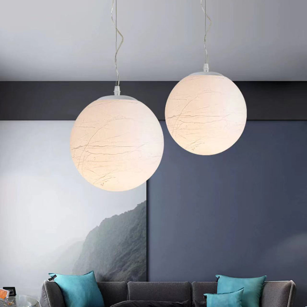 two ambient pendant lights hanging together in a living area, creating balanced diffused light and a relaxed spatial atmosphere