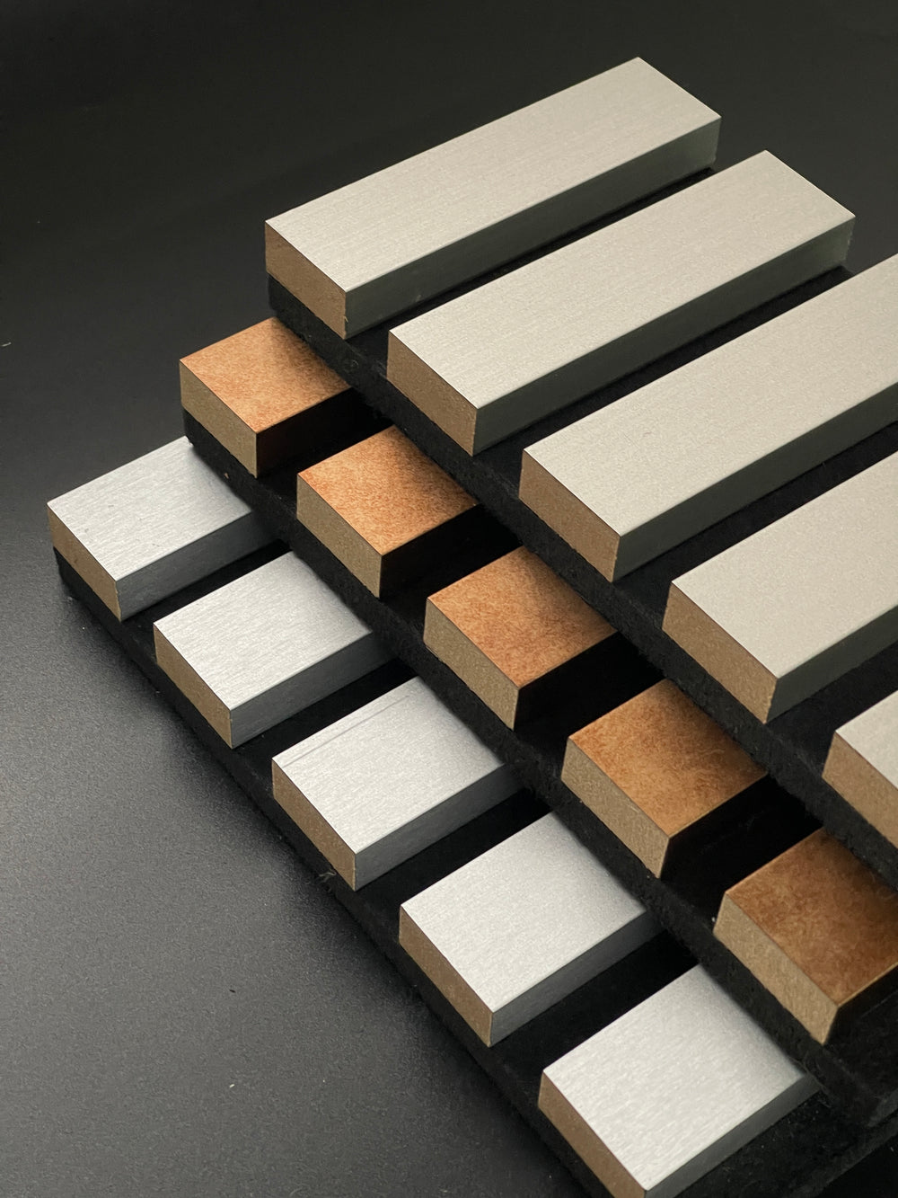 Architectural acoustic wall panel slat system with integrated sound absorbing backing