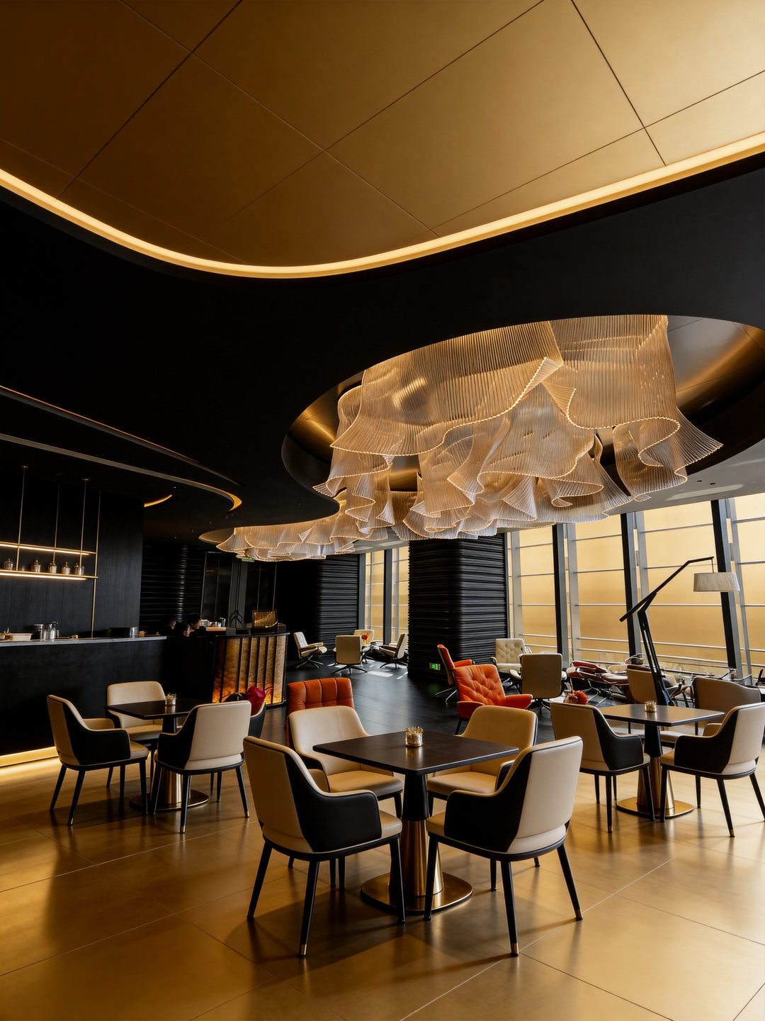 Architectural bespoke pendant light installed in a contemporary hospitality venue with luxury commercial interior styling.