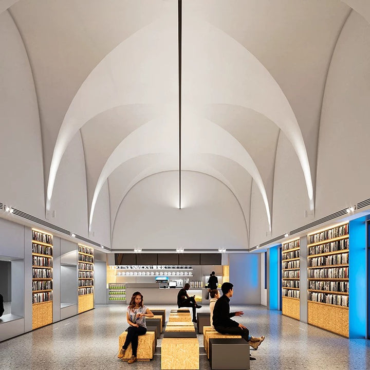 architectural linear LED ceiling light enhancing a white vaulted gallery space with clean continuous illumination