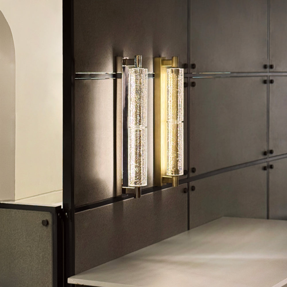 Designer Arctic crystal wall light with brushed metal base providing ambient LED lighting for modern interiors