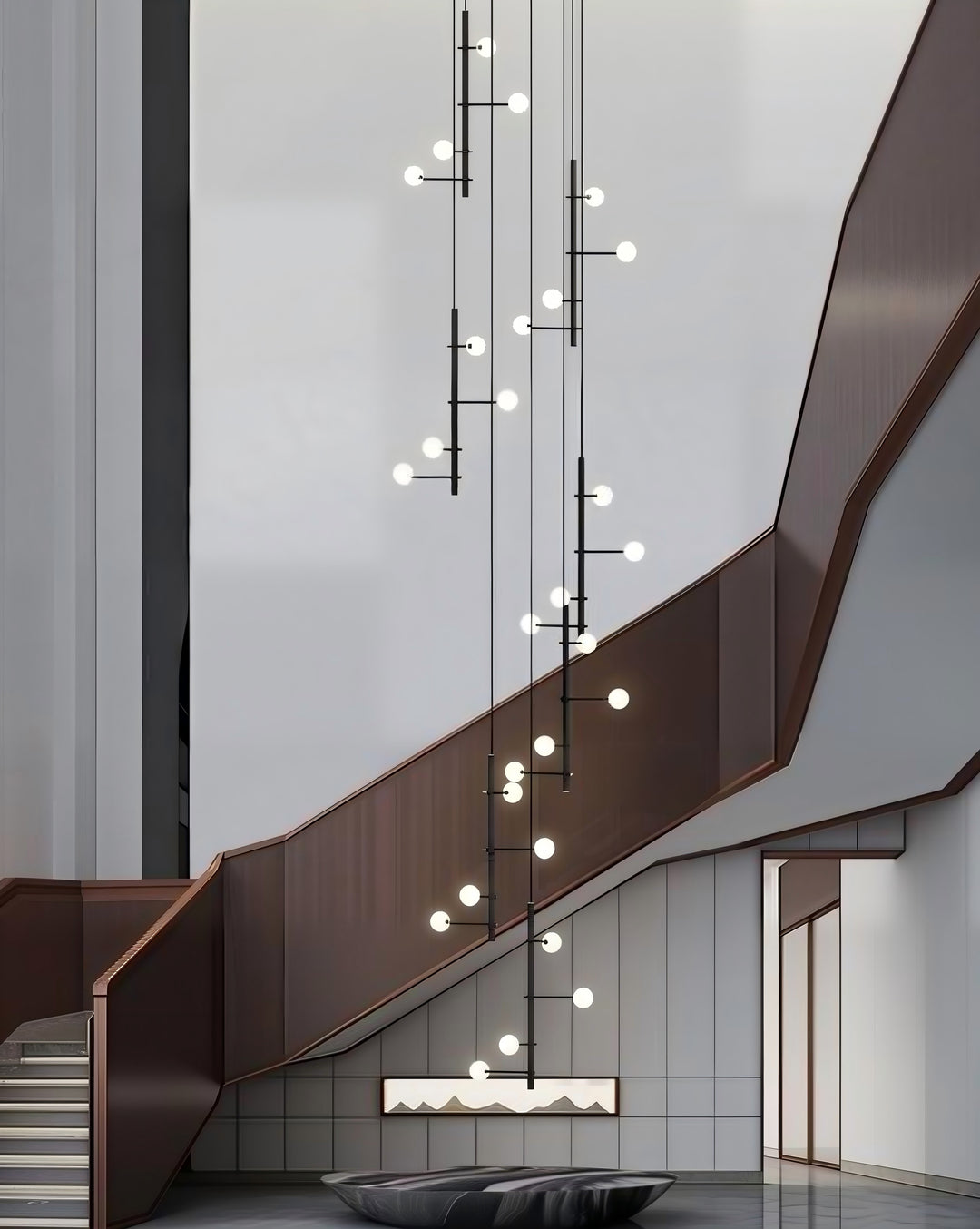 Ascend Globe Pendant Light installed in a modern staircase void with suspended globe lighting for luxury architectural interiors.