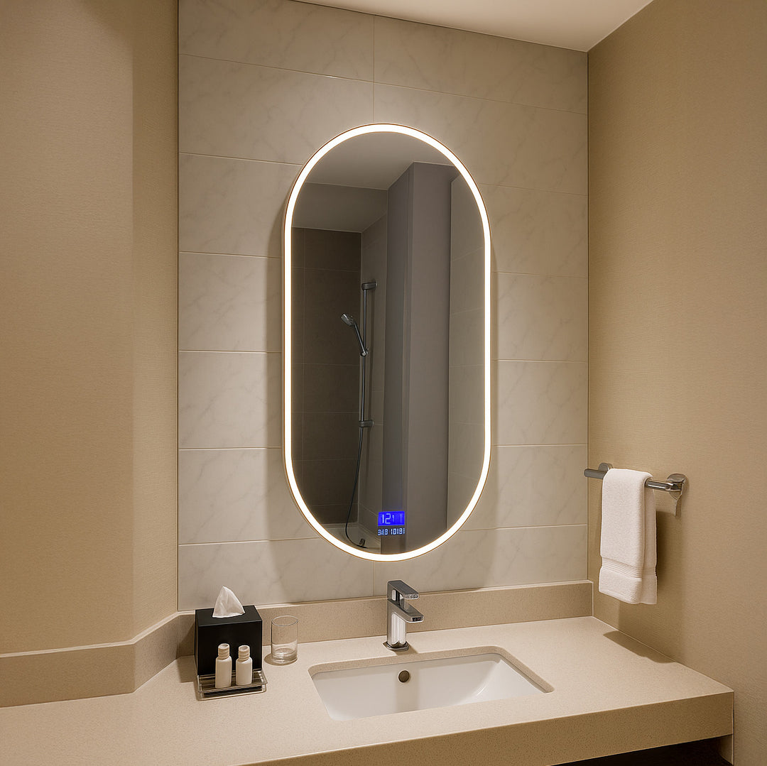 Aurora oval LED mirror installed in a bathroom with front-lit illumination and anti-fog display.