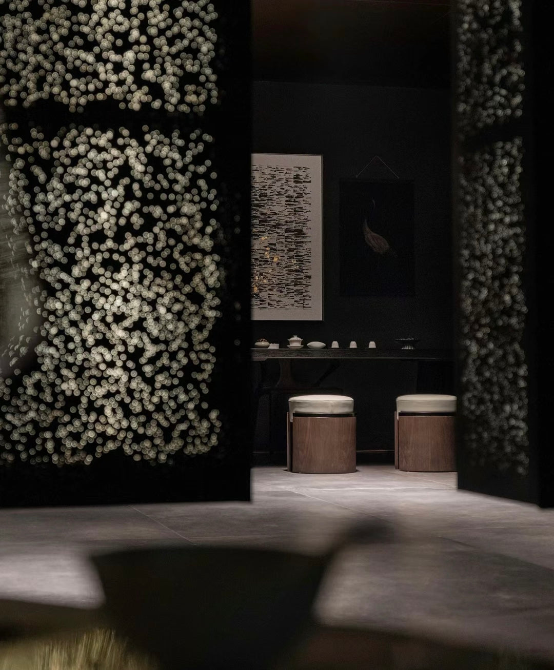 Backlit aluminium foam wall panels creating a textured feature wall in a commercial interior