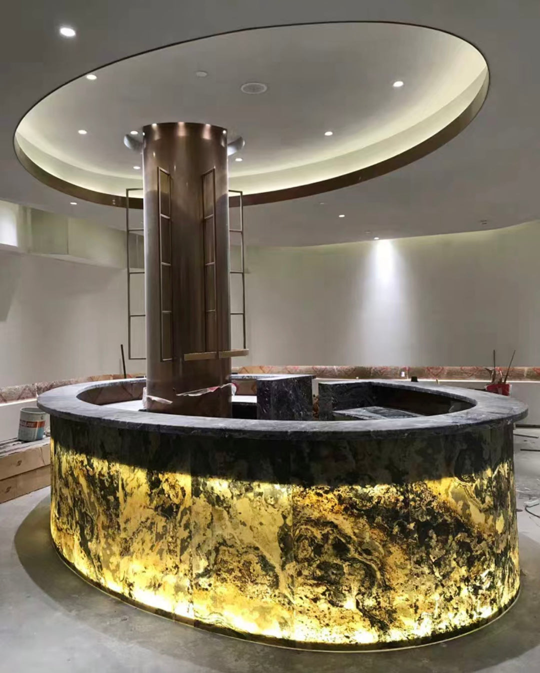 Backlit ultra-thin marble applied to a circular bar structure for decorative interior design