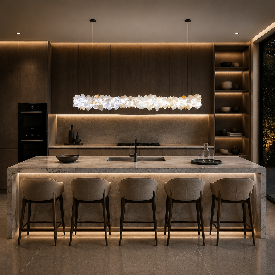 Luxury crystal linear pendant light above a kitchen island, handcrafted Brazilian mineral crystal LED lighting for modern luxury homes, dining spaces and bespoke interior design.