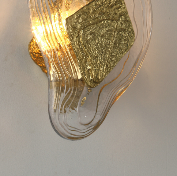 artisan brass and crystal reliquia feature wall lamp highlighting textured glass and warm ambient light