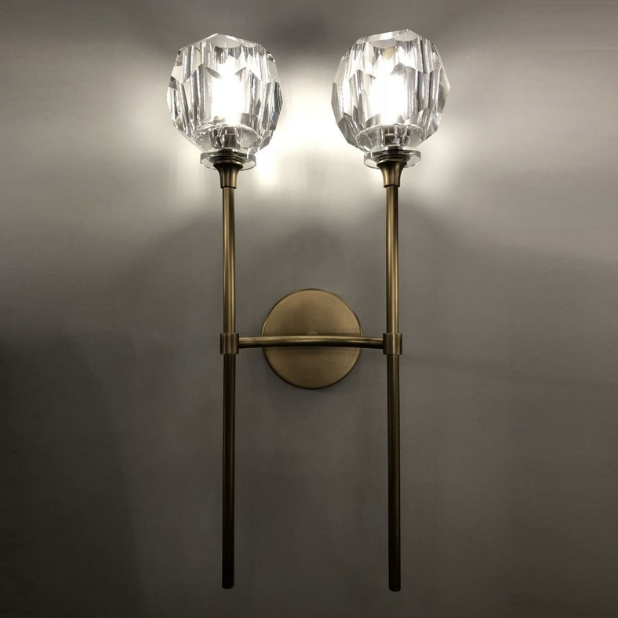 angled view of dual crystal brass wall light providing soft ambient illumination suitable for modern indoor wall lighting elegant home interiors and decorative feature walls