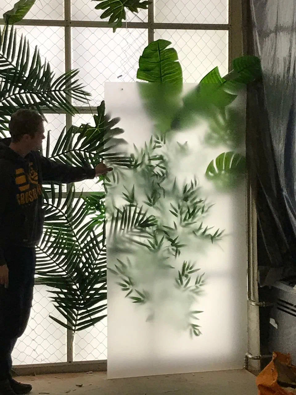 Cloud Silk Board feature wall combined with artificial plants for a nature-inspired interior design