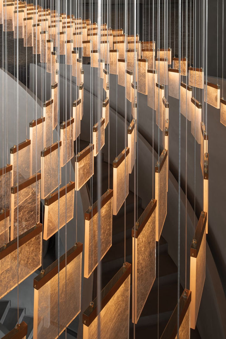 Close-up detail of illuminated textured acrylic panels used in the Cloudveil Bespoke Pendant Light collection.