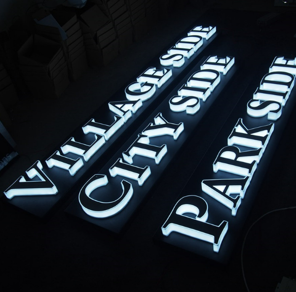 Custom illuminated acrylic letter signs for commercial building and car park signage