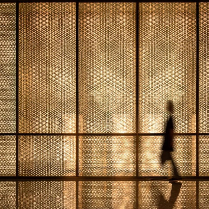 Decorative bamboo wall panels with woven texture used as a feature wall in a modern interior space