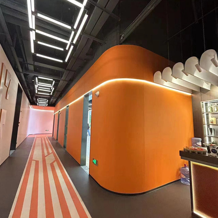 EcoChar fiber panel with fabric texture applied on a curved interior wall.