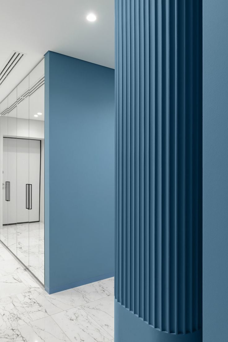 EcoSpin timber louver wall panel used as a bedroom feature wall with warm natural wood finish