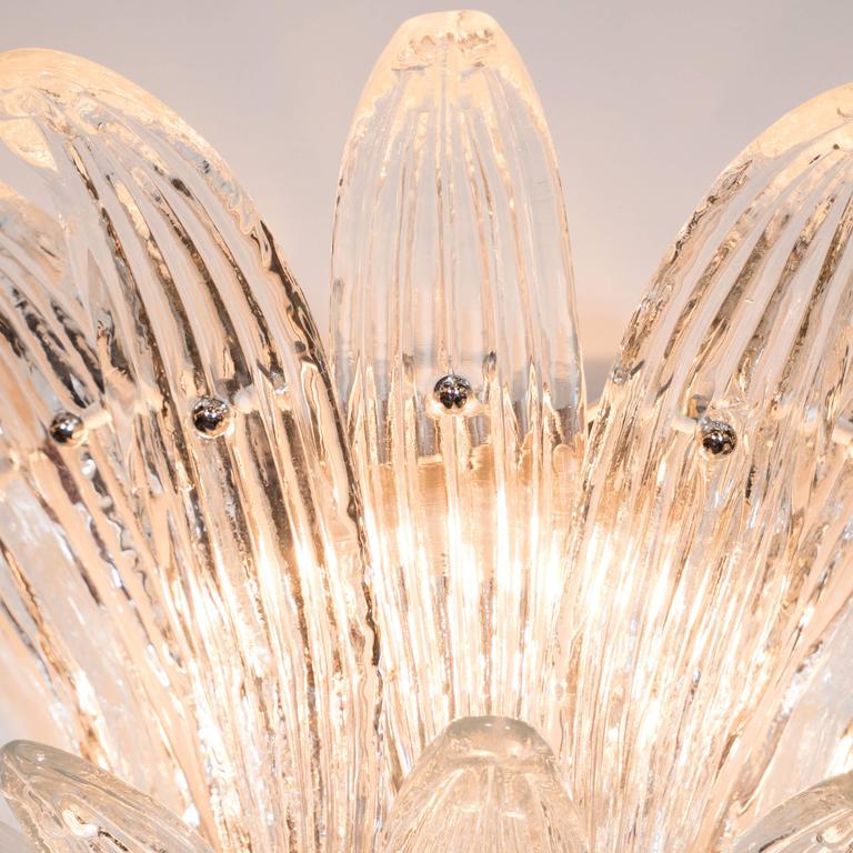 fan shaped crystal designer wall light illuminating a modern interior with soft ambient lighting