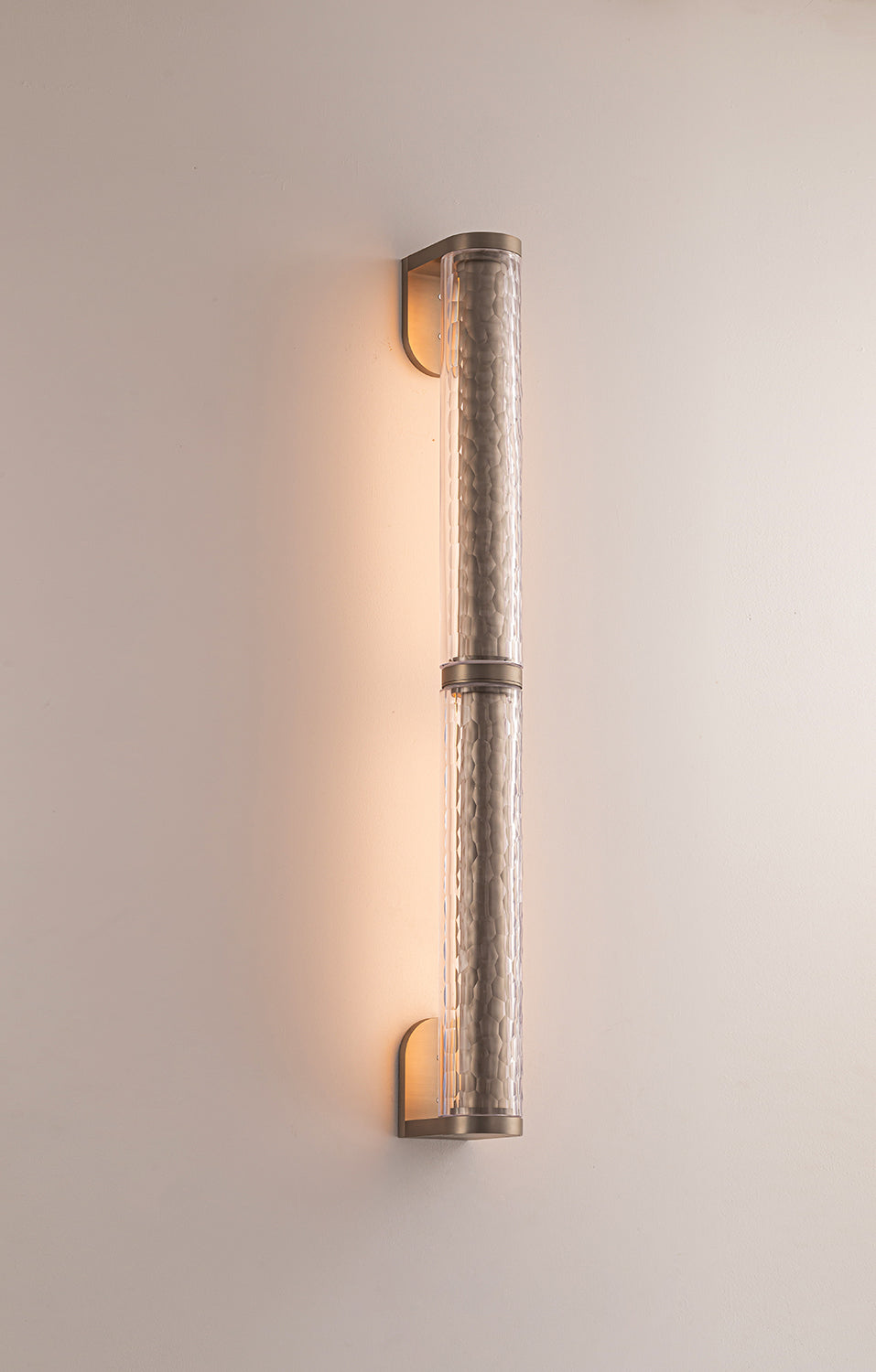 Feature wall lighting with warm LED glow from double wall light
