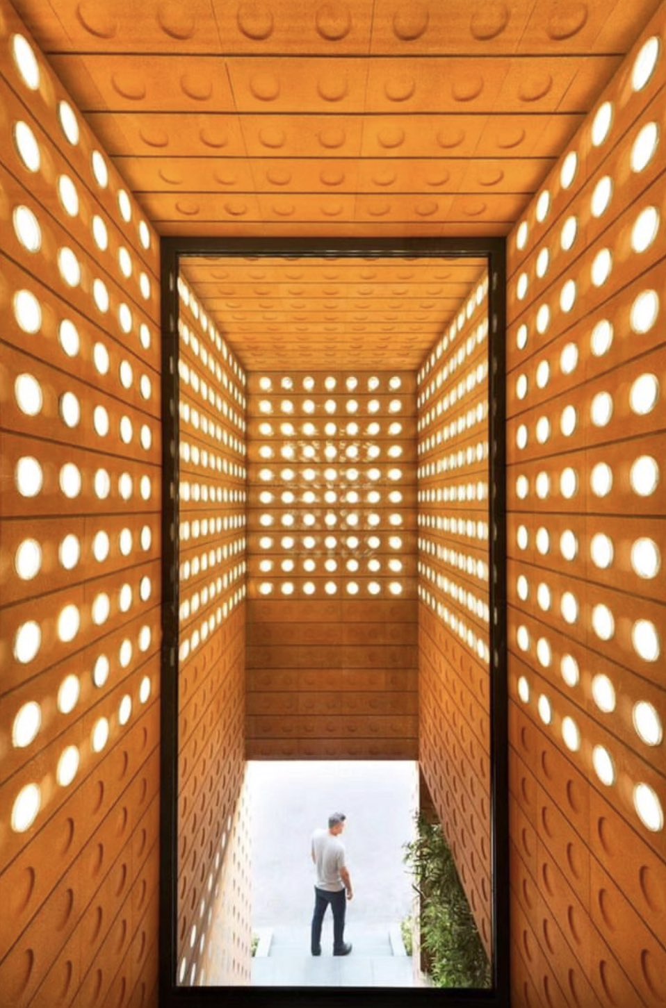 Foam ceramic blocks creating a light filtering architectural wall structure