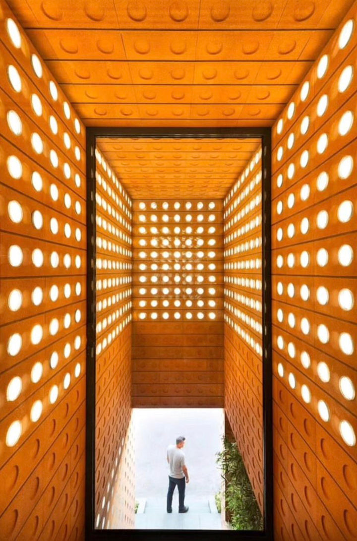 Foam ceramic blocks creating a light filtering architectural wall structure