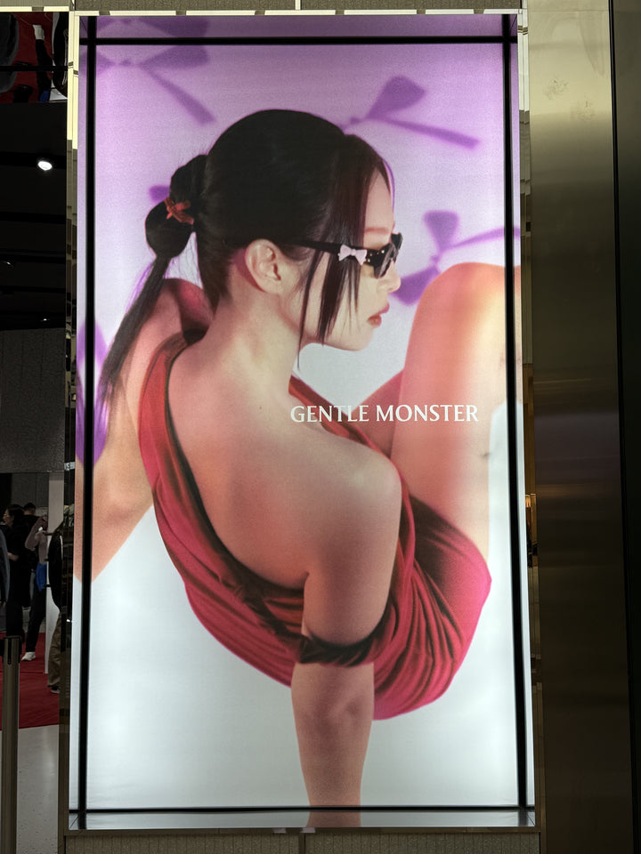 Freestanding LED backlit fabric light box presenting high-resolution imagery for retail advertising.