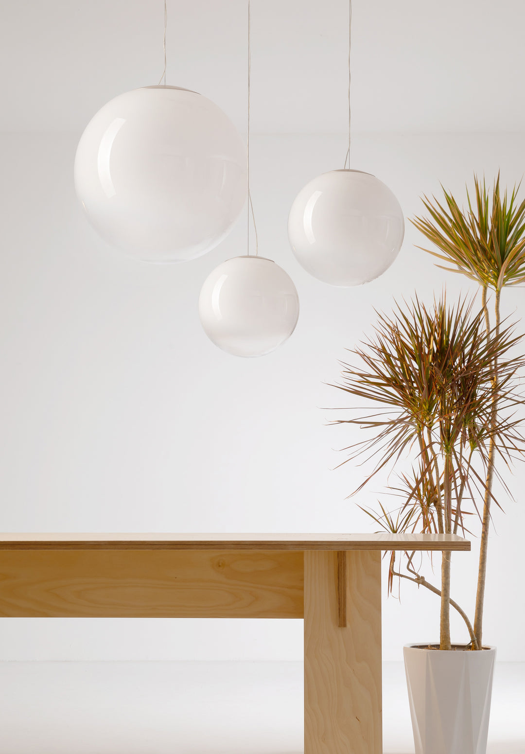 Frosted glass sphere pendant light for modern dining and living interiors