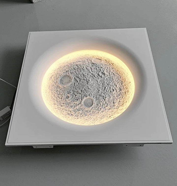 recessed round gypsum moon ceiling light providing warm ambient LED illumination with sculptural crater texture