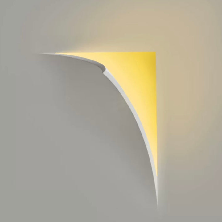 gypsum tear wall light providing indirect LED ambient illumination on a minimalist white wall