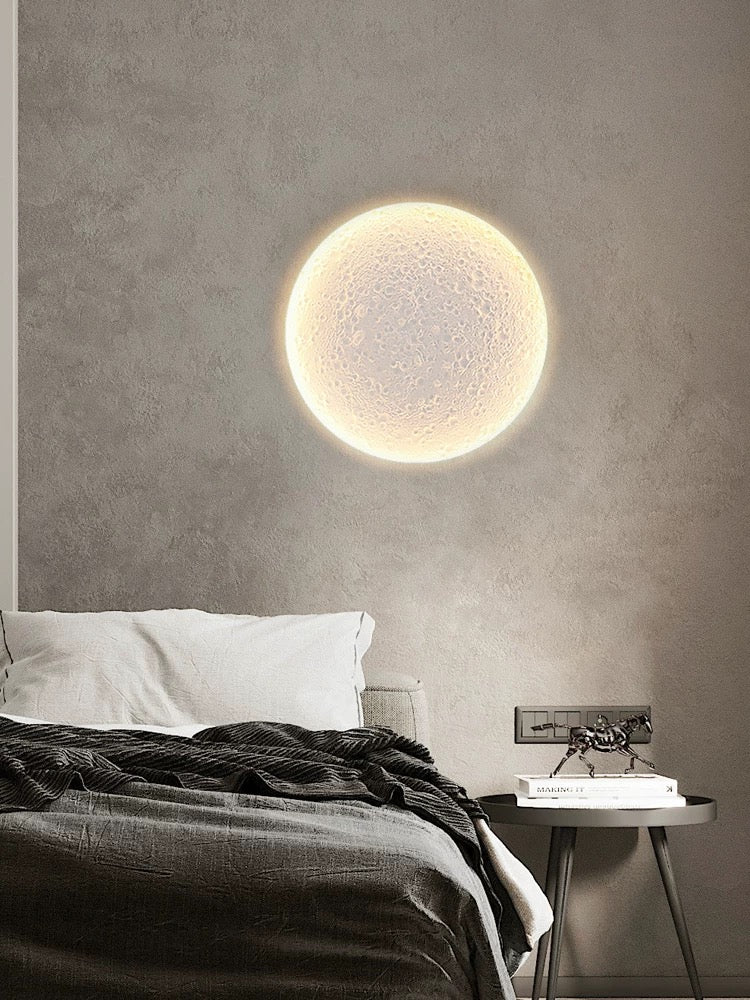 round gypsum wall light providing soft ambient indoor lighting on a textured grey wall