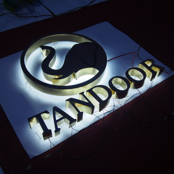 Halo-lit channel letter logo sign with LED backlighting, designed for restaurant and commercial branding environments.