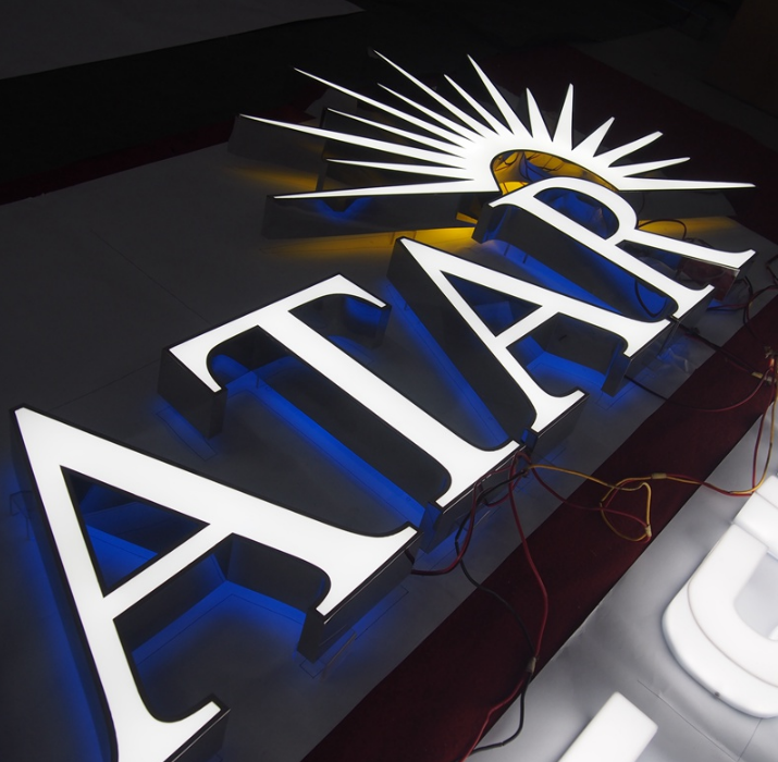 Halo lit channel letter sign with front and rear LED illumination for premium business signage