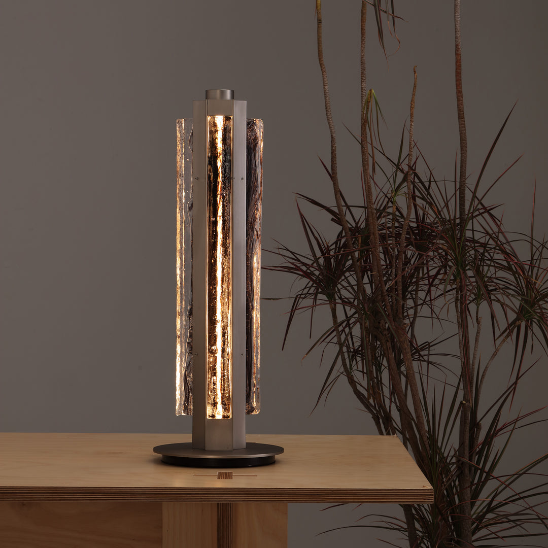 Hand-blown glass table lamp on wooden table, designer lighting Running Water Trio by Lucretia Lighting