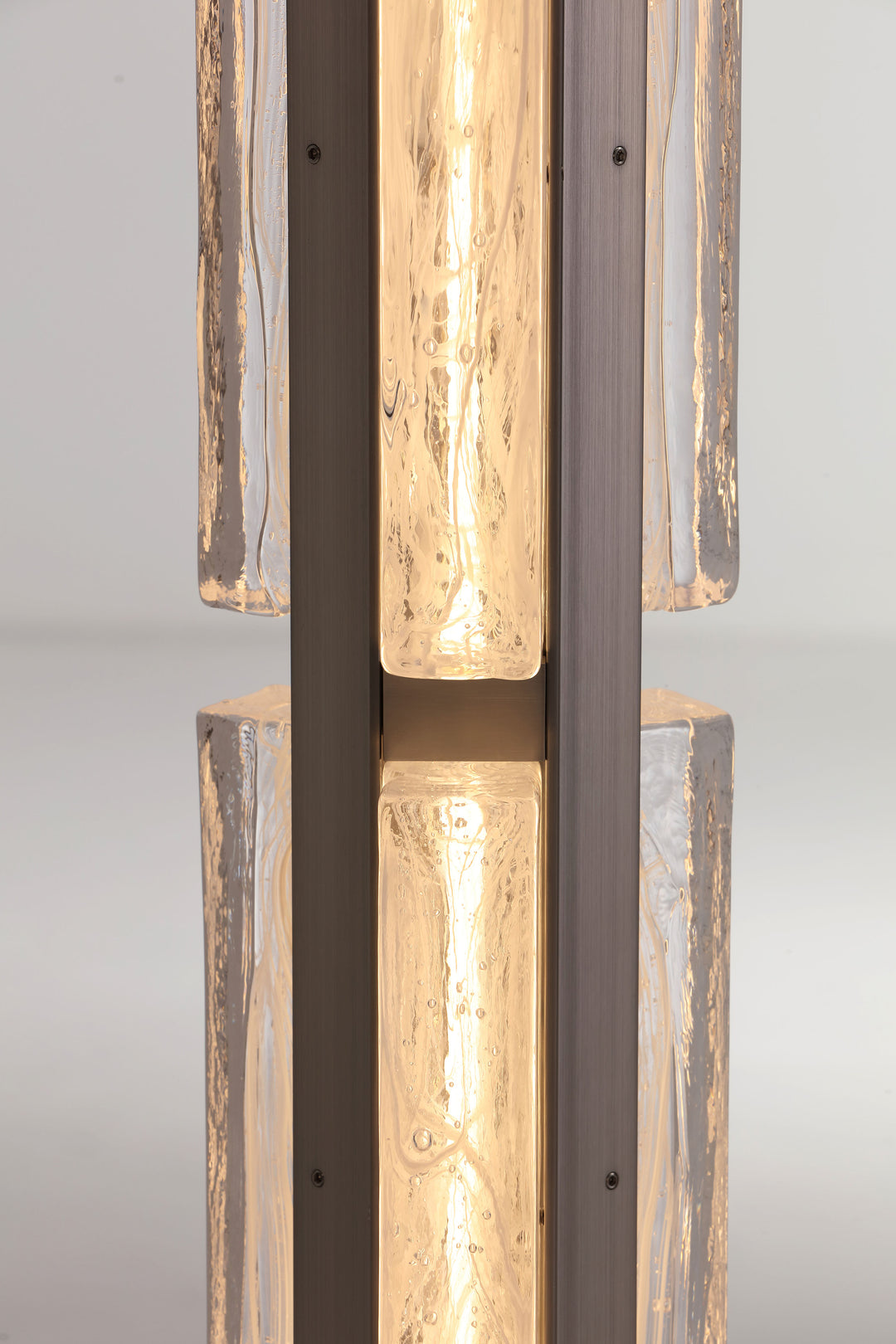 Close-up of hand-blown textured glass showing organic flowing pattern and light diffusion