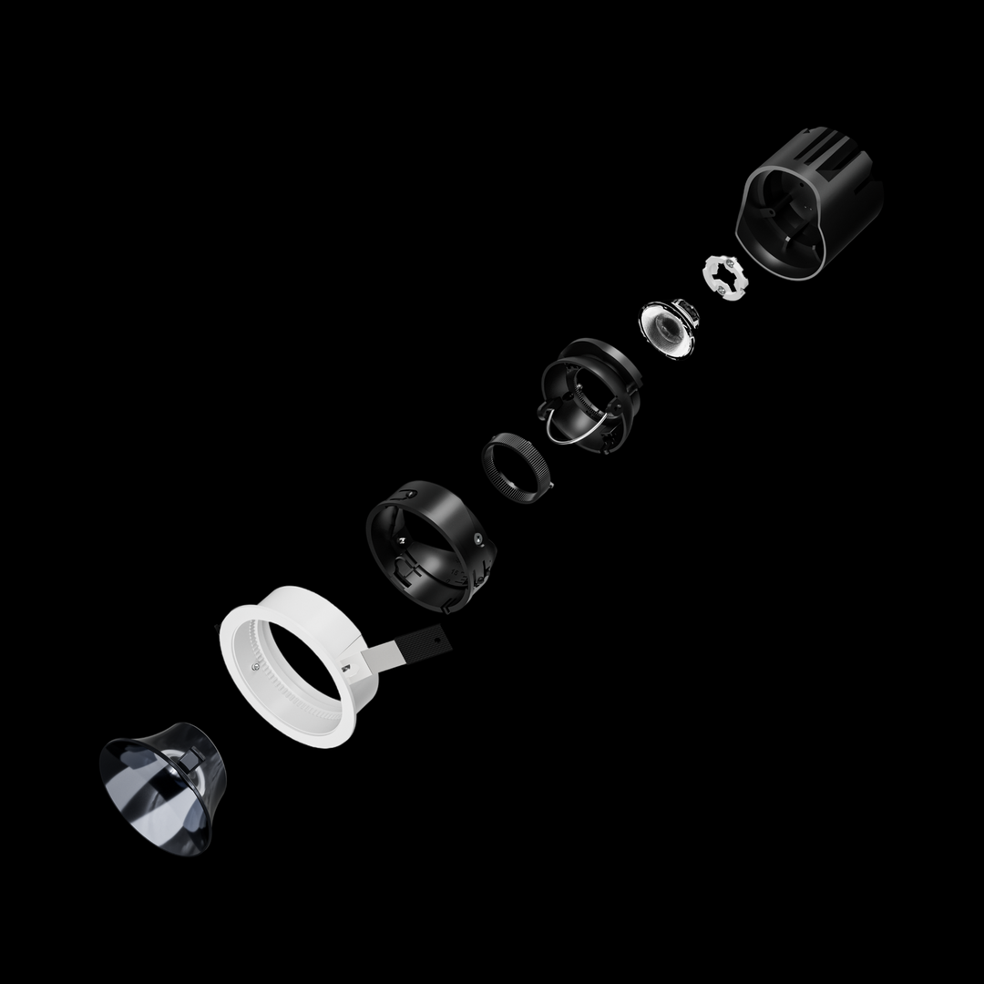 Exploded view of recessed LED downlight showing optical components and serviceable modular design