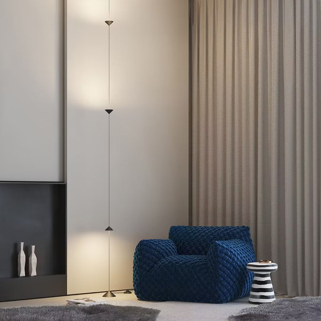 Hourglass Wall Lamp used as a contemporary lighting feature beside curtains.