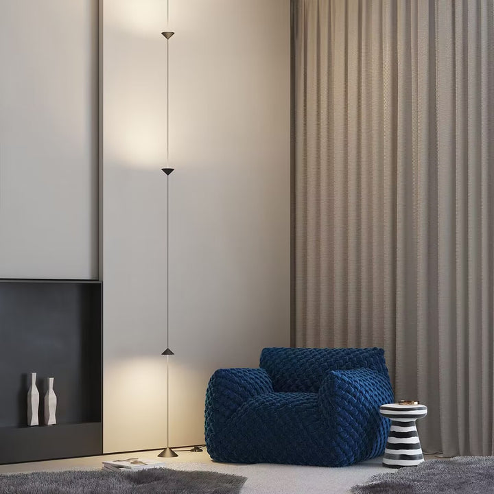 Hourglass Wall Lamp used as a contemporary lighting feature beside curtains.