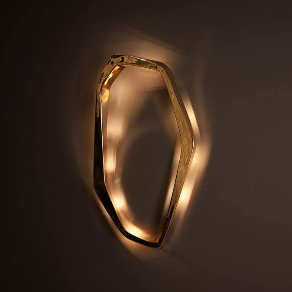 interior scene showing i do wall lamp d mounted on wall with soft ambient led glow highlighting sculptural organic ring silhouette