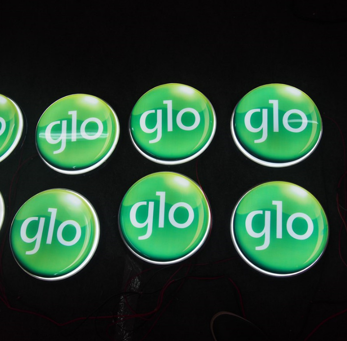 Illuminated light box signs used for retail branding, featuring bright LED light box displays.