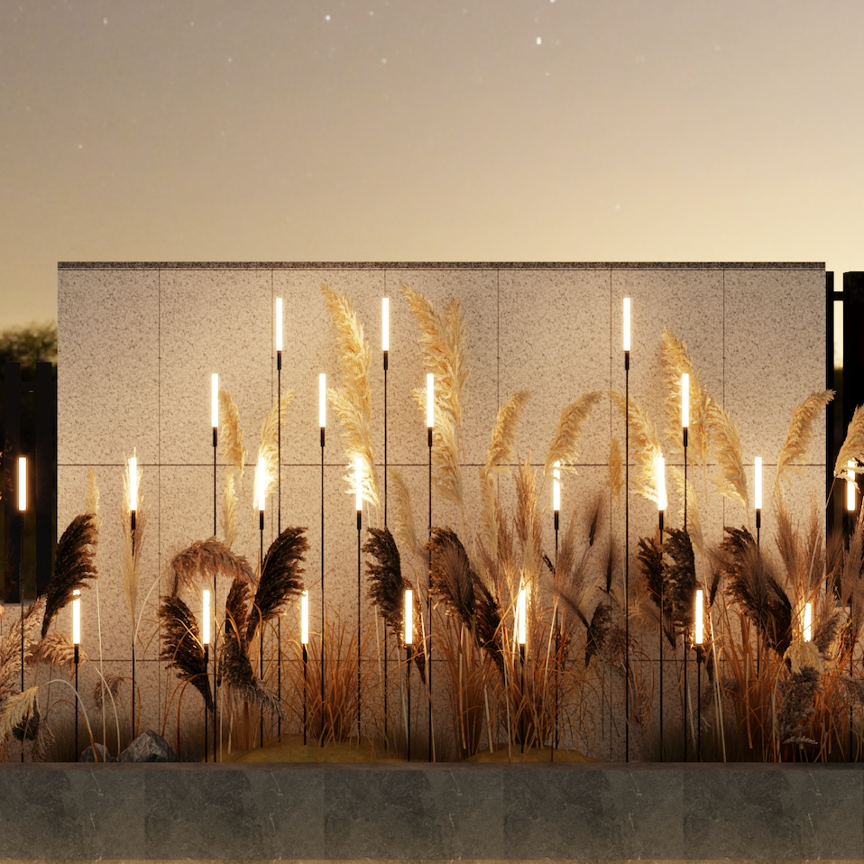 Decorative landscape reed spike lights creating ambient garden feature lighting in a modern outdoor setting