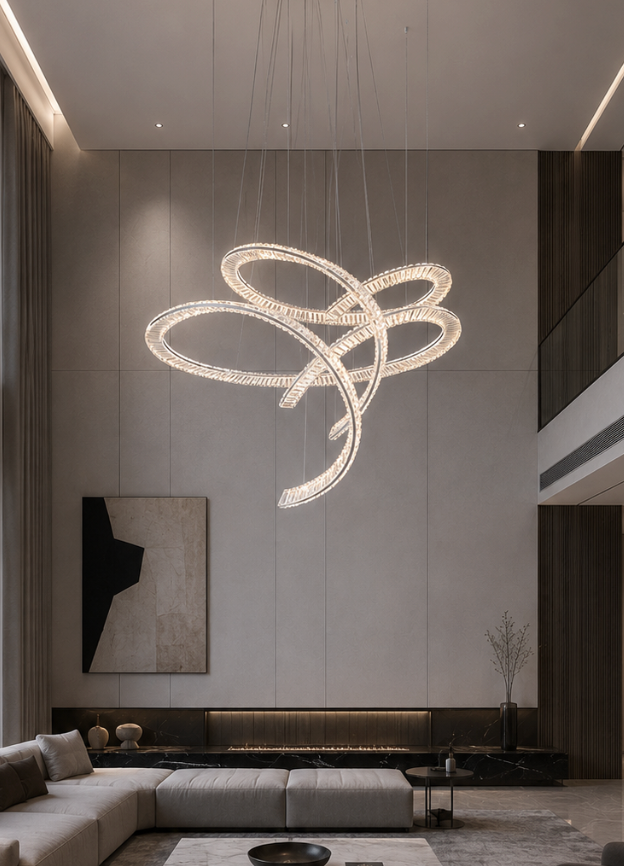 Large-scale sculptural crystal loop chandelier in a modern luxury double-height living room with linear fireplace and abstract artwork, Pharaoh Rosette Chandelier by Lucretia