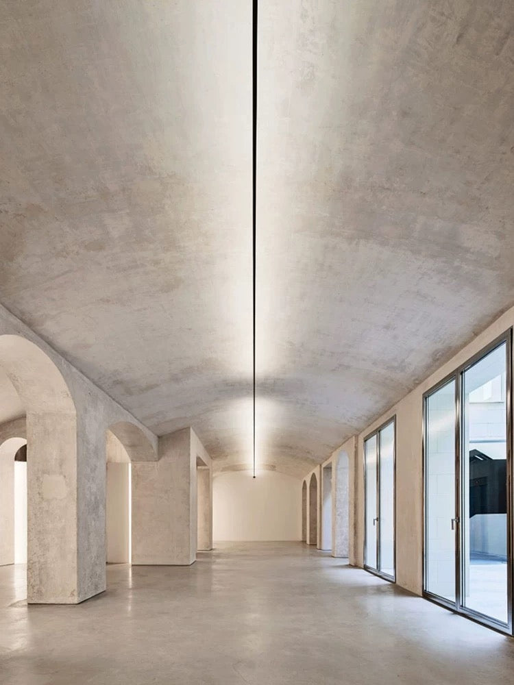 linear LED ceiling light used in a contemporary corridor providing smooth shadow-free architectural illumination
